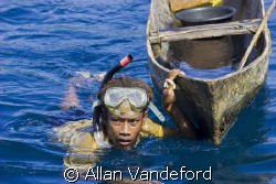 Young future-diver with canoe in tow.  The image was take... by Allan Vandeford 